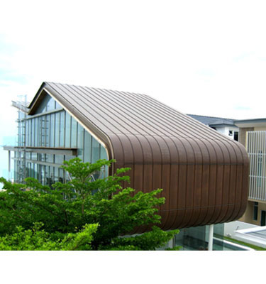 Sheet Metal Roofing Pte Ltd specializes in a roofing and wall cladding technique known as Copper Bronze Roof and Wall Cladding in Double Standing Seam System with curved transitions to Wall and Soff.